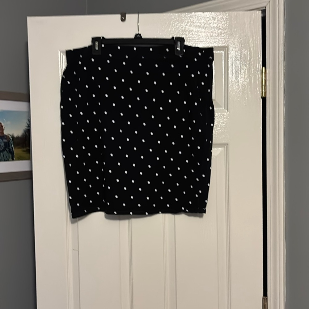 Previously loved black mini skirt with square dots.